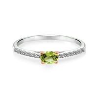 Gem Stone King 0. CT okrugli zeleni peridot bijeli dijamantski srebrni i 10k ružični zlatni prsten